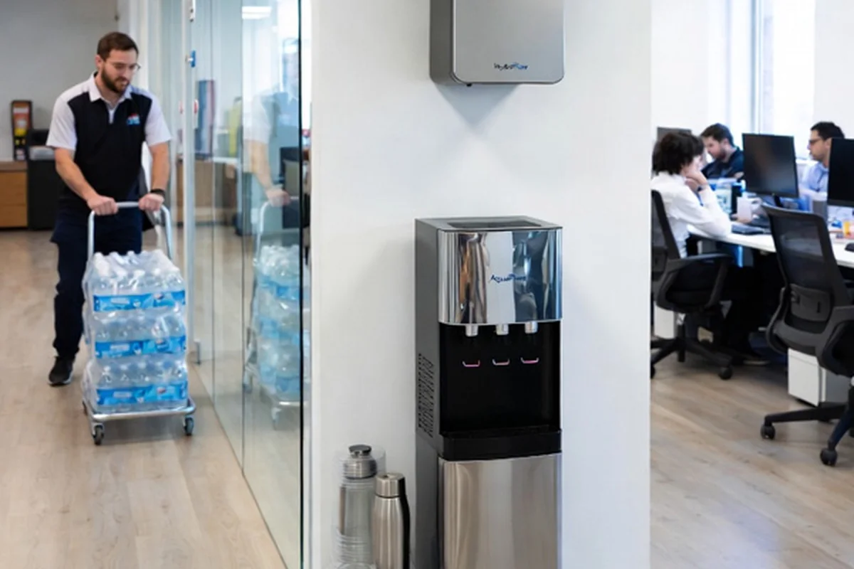 Office manager comparing workplace water service details